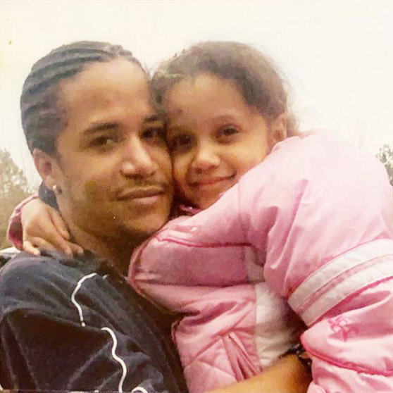 Kelvin Silva holds his daughter.